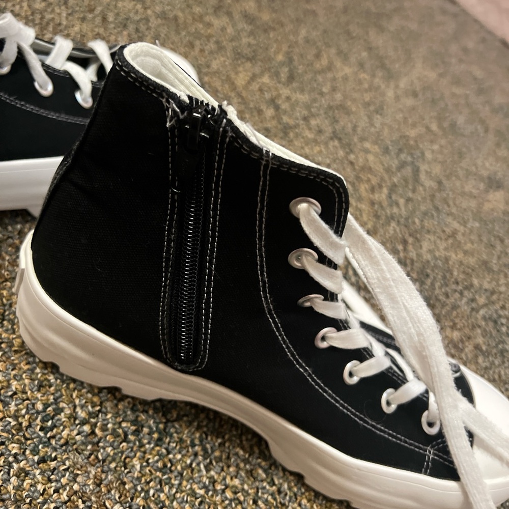 Platform shoes, not real converse. High tops with a zipper. Rarely wore.